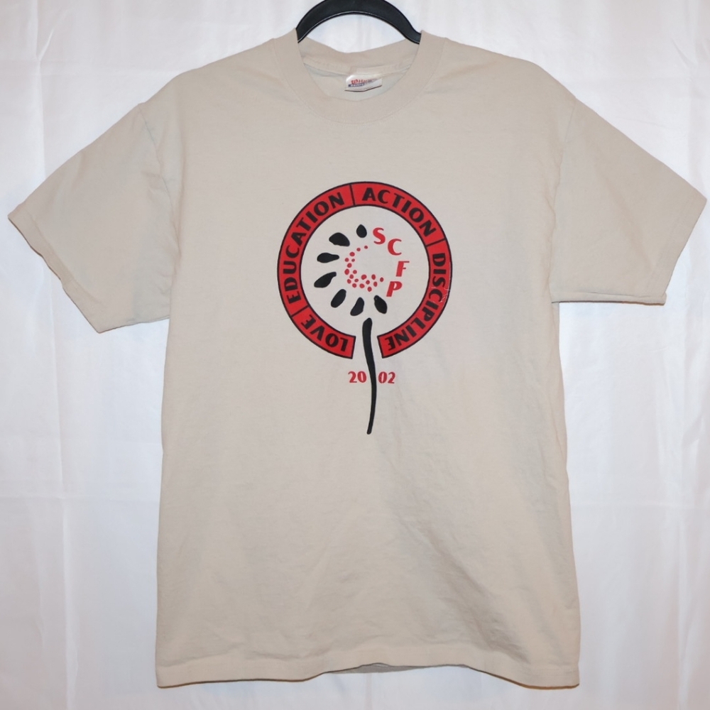 2002 Sunflower County Freedom Project Shirt-Beige, Red, & Black. Adult Medium.